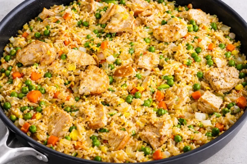 Easy chicken rice dinner for quick meals with diced chicken, vegetables, and fluffy rice cooked in one pan