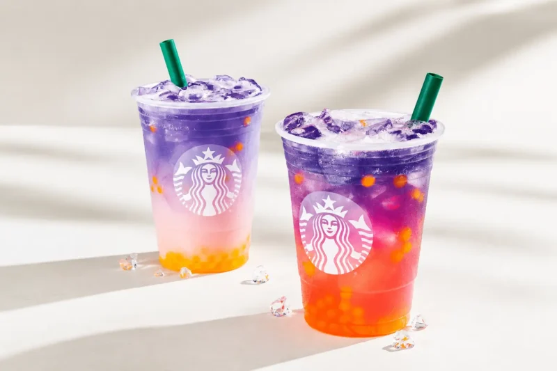 Colorful layered Starbucks summer drinks with purple, pink, and orange gradients served over ice in clear cups for the Starbucks Summer 2026 menu preview.